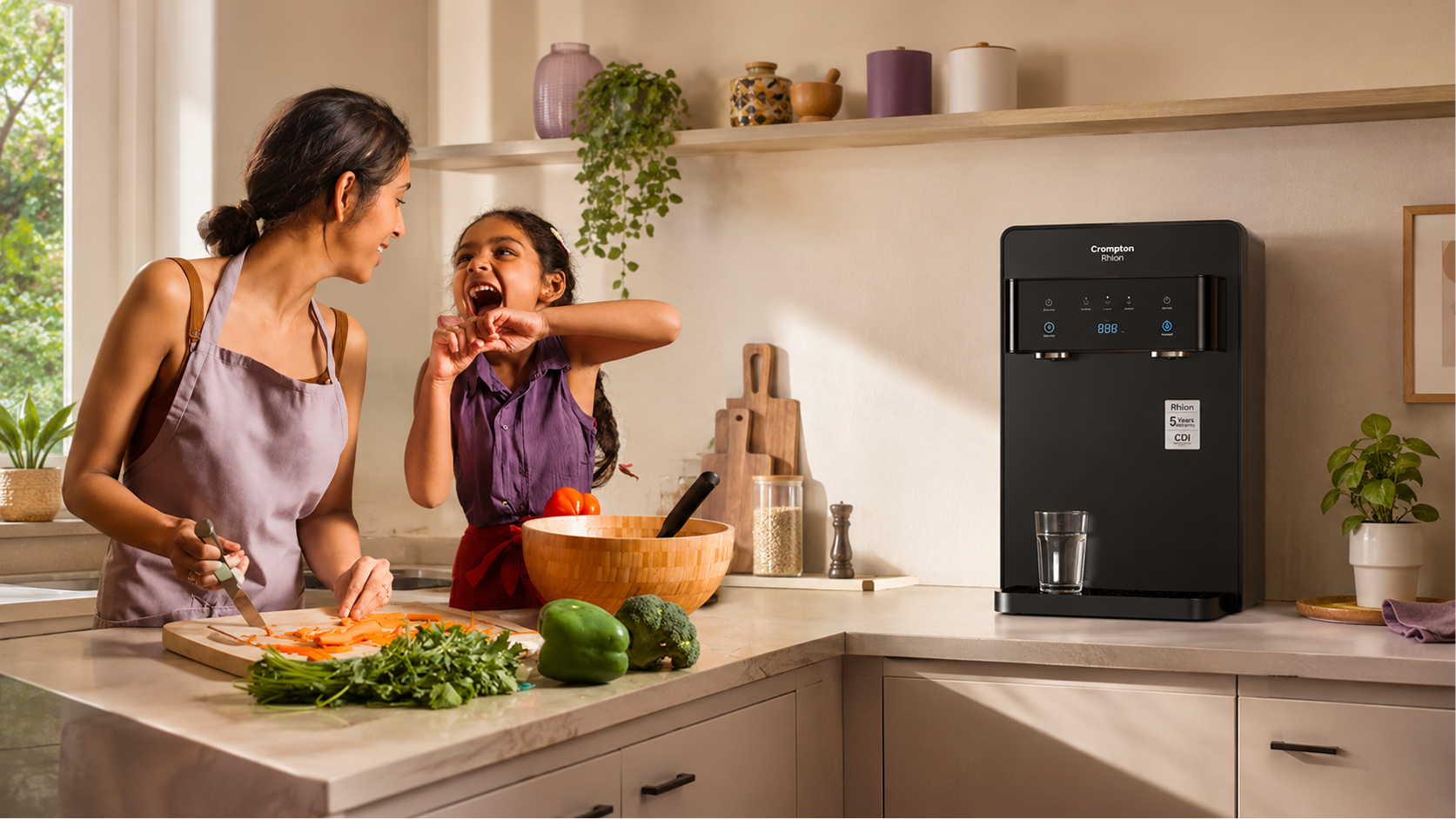 A mother and daughter cooking together beside a Crompton Rhion purifier